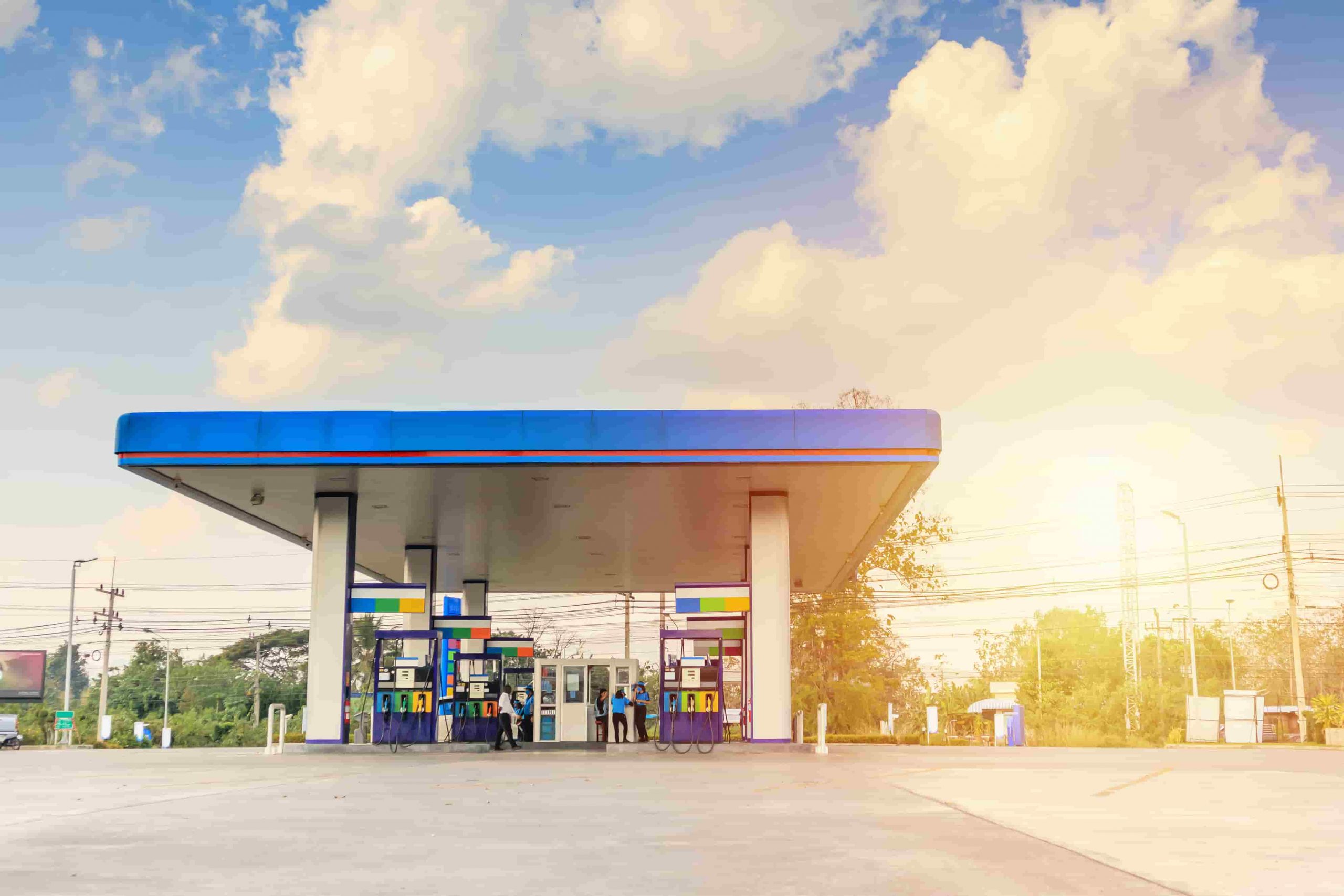 petrol-gas-fuel-station-with-clouds-blue-sky-min